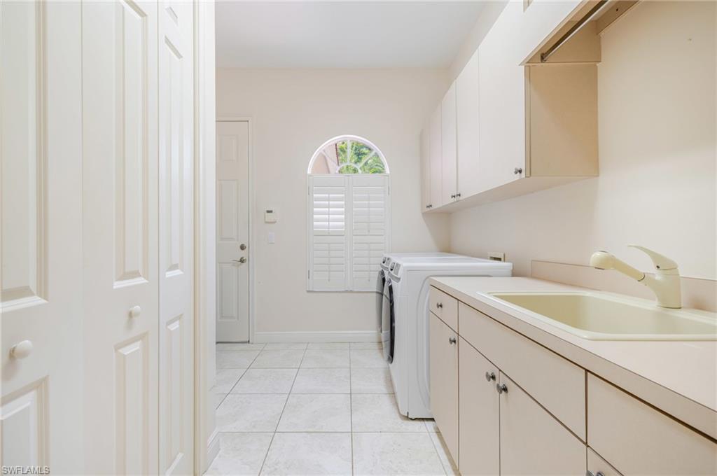 20481 Chapel Trace Estero, FL 33928 - Photo 29 of 50 a kitchen with a sink cabinets and a window
