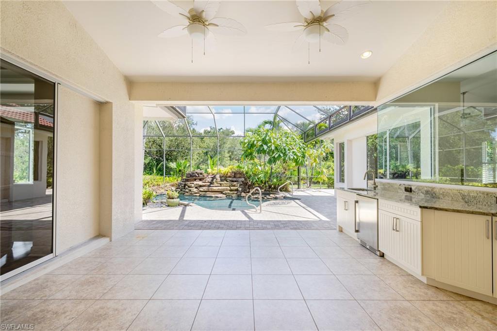 20481 Chapel Trace Estero, FL 33928 - Photo 32 of 50 a living room with furniture and a large window