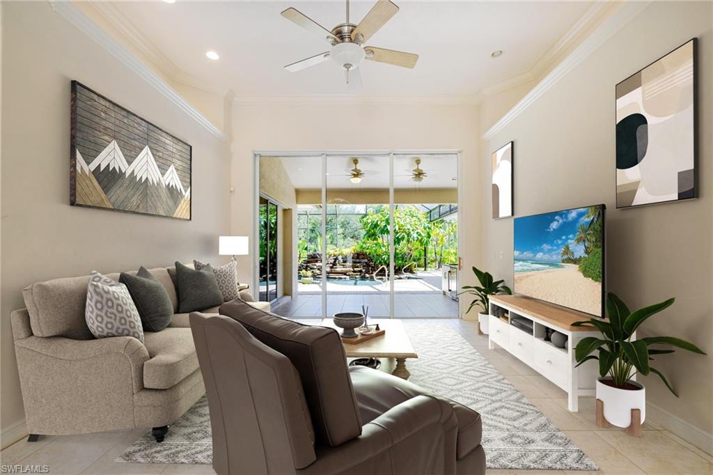 20481 Chapel Trace Estero, FL 33928 - Photo 4 of 50 a living room with furniture ceiling fan and a large window