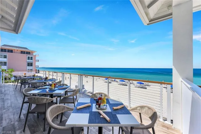 a outdoor dining space with furniture and outdoor view