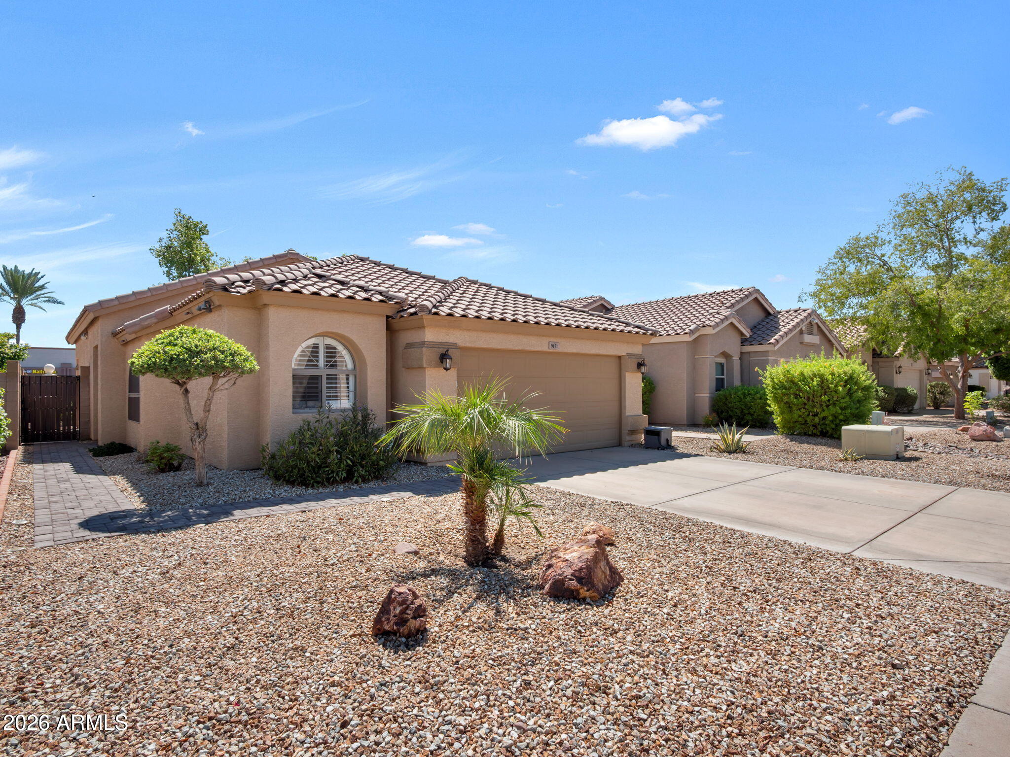 9151 West Boca Raton Road Peoria, AZ 85381 - Photo 1 of 14 Crubside View shows paver walkway