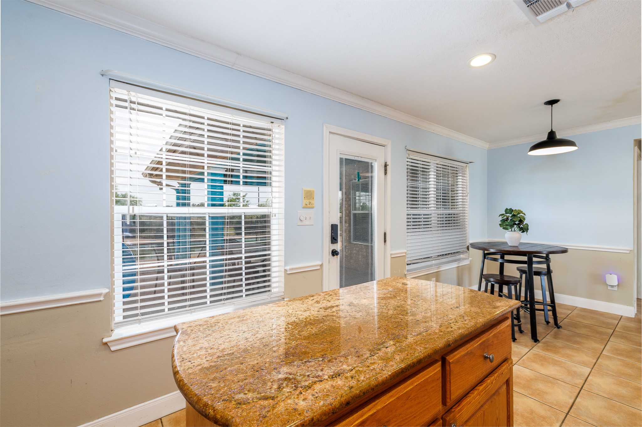 1710 Harwood Road Luling, TX 78648 - Photo 13 of 30 An inviting kitchen area features durable tile flooring and polished granite countertops.