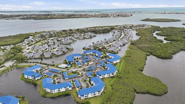 an aerial view of a house with a lake view