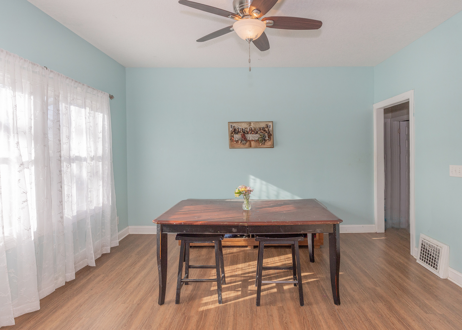 2330 38th Street Rock Island, IL 61201 - Photo 12 of 34 a view of a dining room with furniture and wooden floor