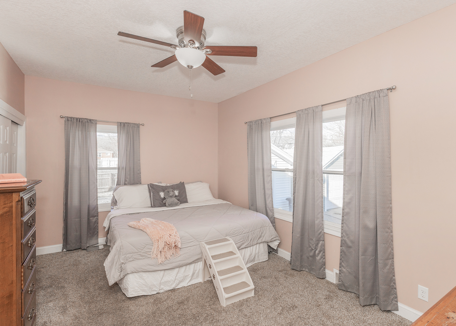 2330 38th Street Rock Island, IL 61201 - Photo 17 of 34 a bedroom with a large bed chandelier and a window