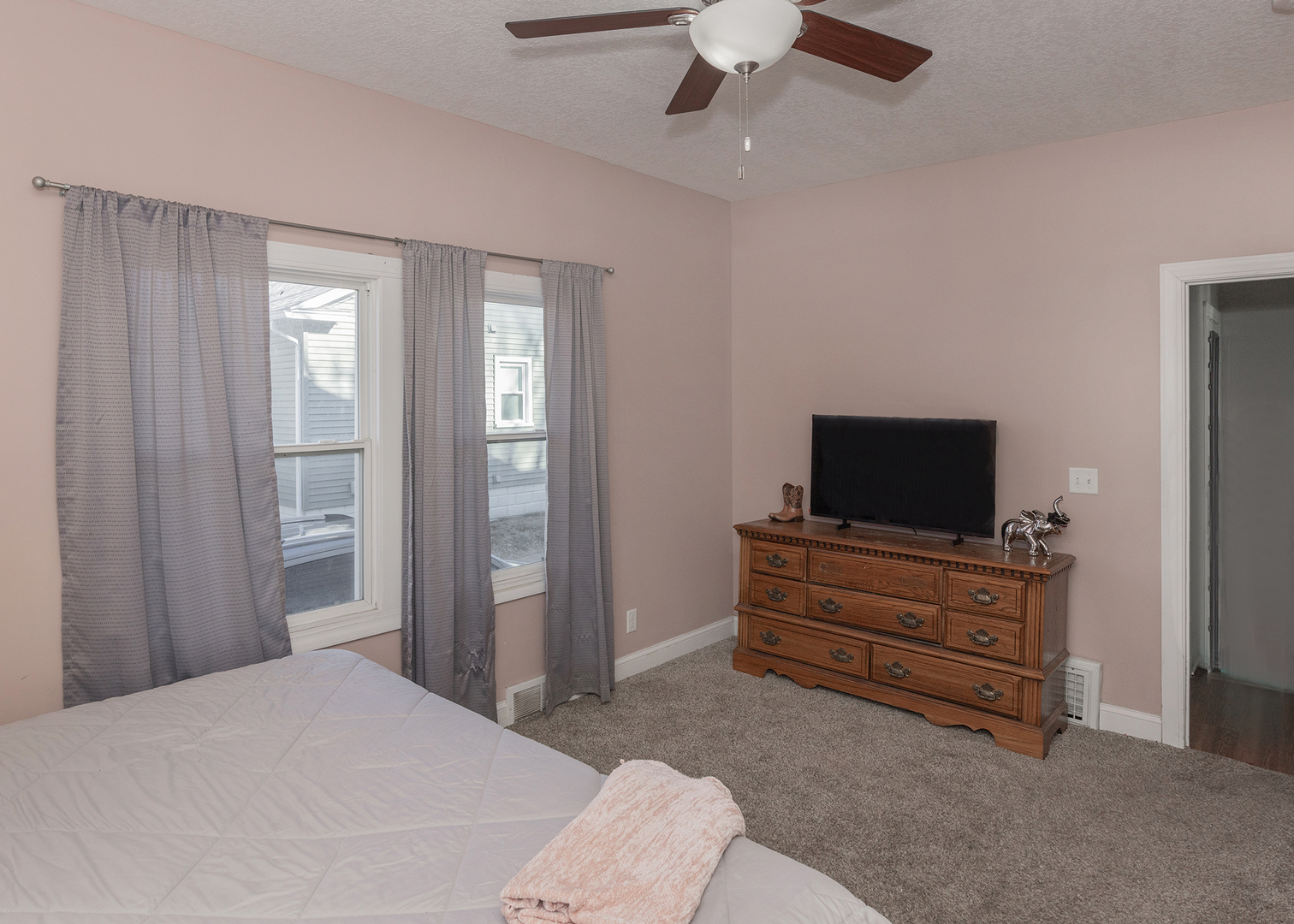 2330 38th Street Rock Island, IL 61201 - Photo 19 of 34 a bedroom with a bed and a television