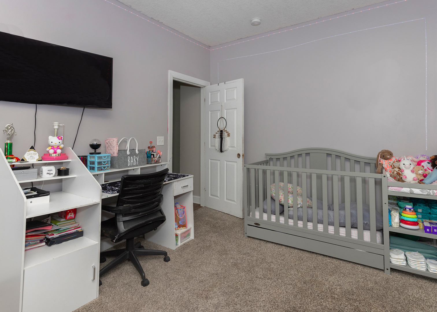 2330 38th Street Rock Island, IL 61201 - Photo 23 of 34 a bedroom with furniture and a flat screen tv
