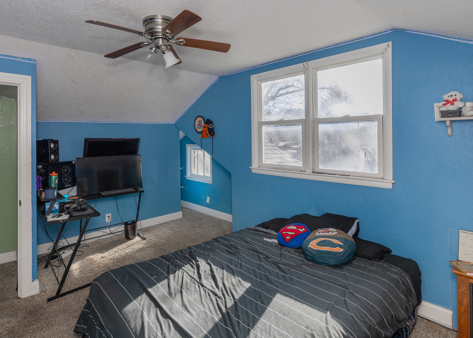 2330 38th Street Rock Island, IL 61201 - Photo 29 of 34 a bedroom with a bed and a chandelier
