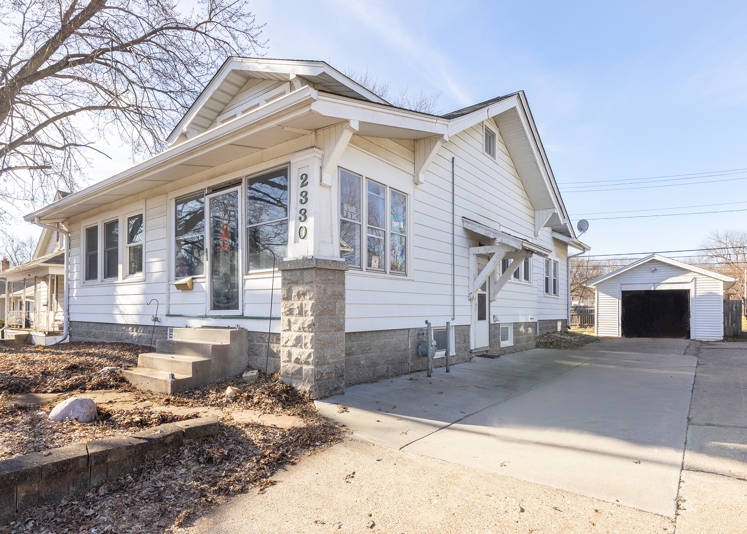 2330 38th Street Rock Island, IL 61201 - Photo 34 of 34 a front view of a house with a yard
