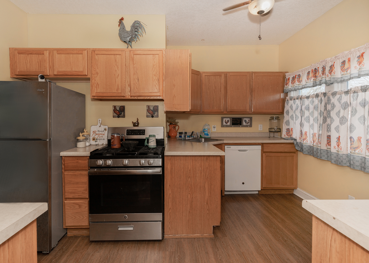 2330 38th Street Rock Island, IL 61201 - Photo 6 of 34 a kitchen with a stove a sink and a refrigerator