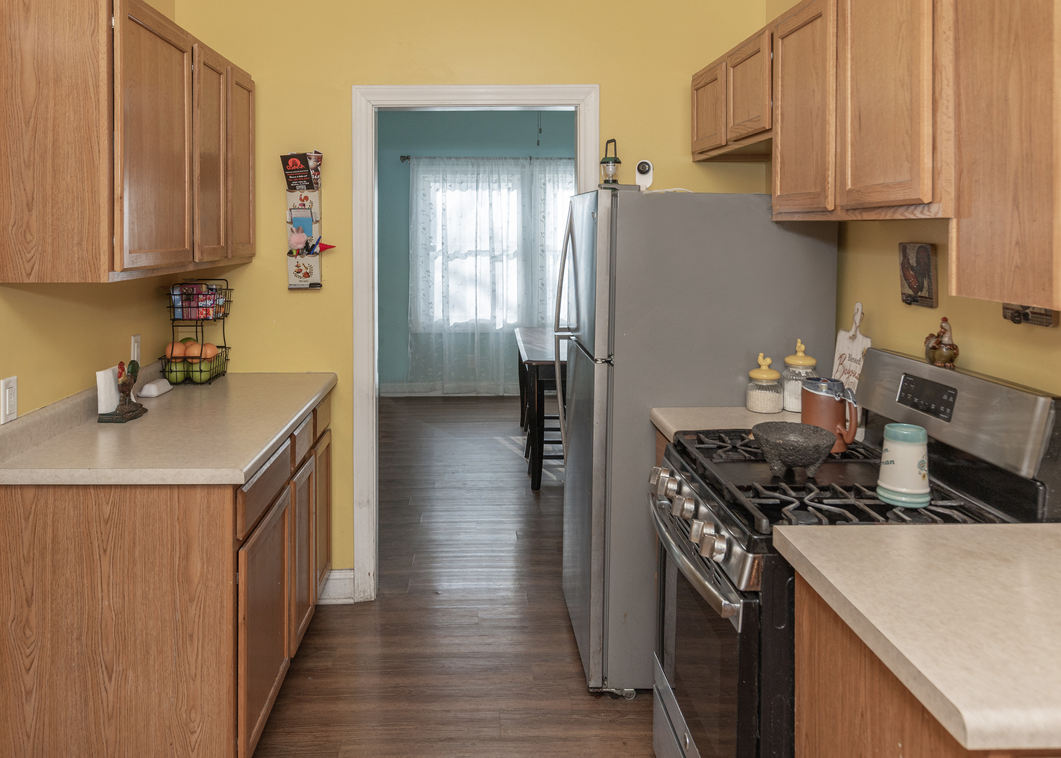 2330 38th Street Rock Island, IL 61201 - Photo 7 of 34 a kitchen with stainless steel appliances a stove a sink and a refrigerator