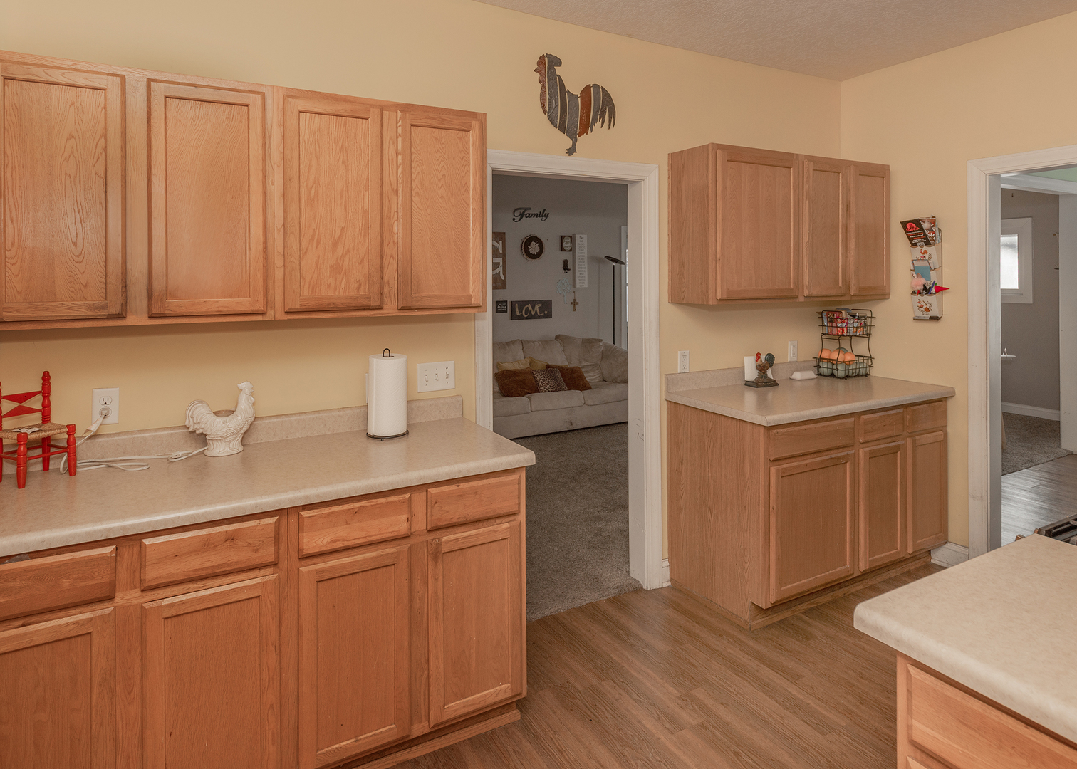 2330 38th Street Rock Island, IL 61201 - Photo 8 of 34 a kitchen with sink cabinets and wooden floor