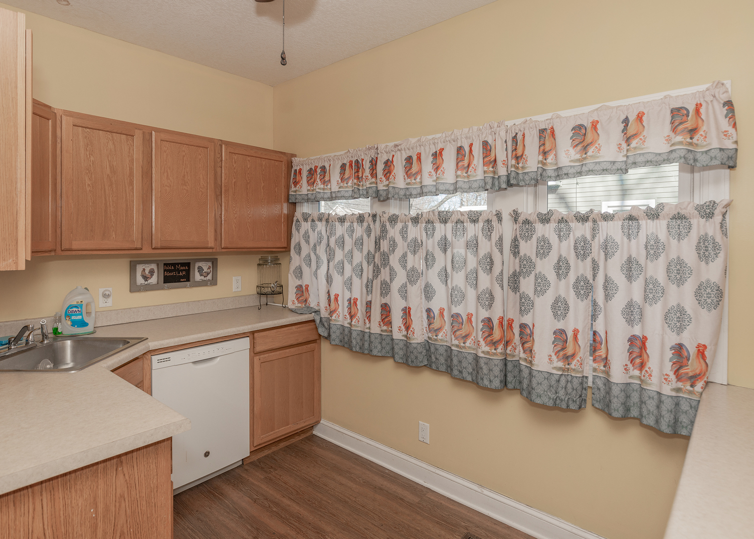 2330 38th Street Rock Island, IL 61201 - Photo 10 of 34 a kitchen with cabinets and wooden floor