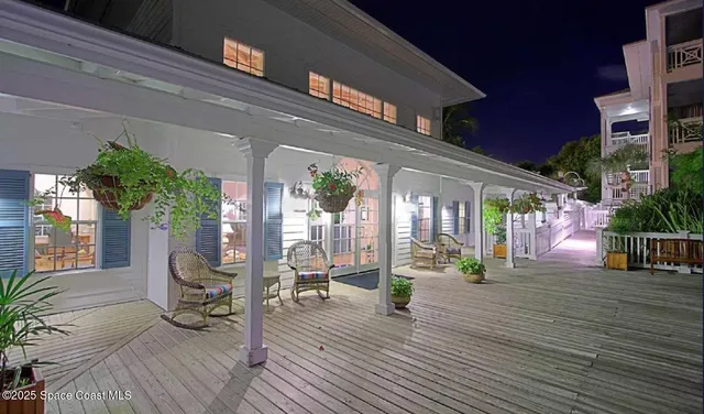 a view of living room with furniture and wooden floor