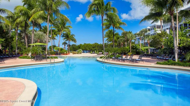 a view of a swimming pool with a table and chairs