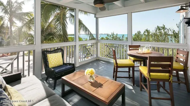 a balcony view with a seating space