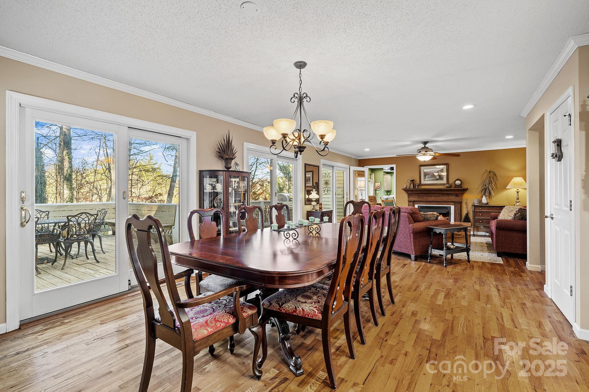 22 Sunset Lane Alexander, NC 28701 - Photo 15 of 48 a view of a dining room with furniture window and wooden floor