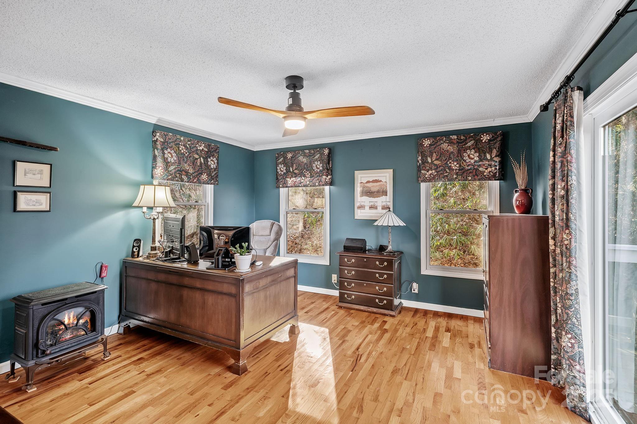22 Sunset Lane Alexander, NC 28701 - Photo 17 of 48 a living room with furniture and a flat screen tv