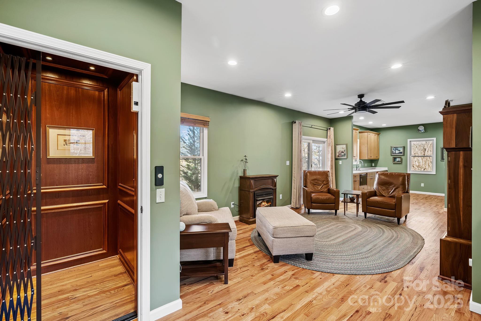 22 Sunset Lane Alexander, NC 28701 - Photo 20 of 48 a living room with furniture and a wooden floor