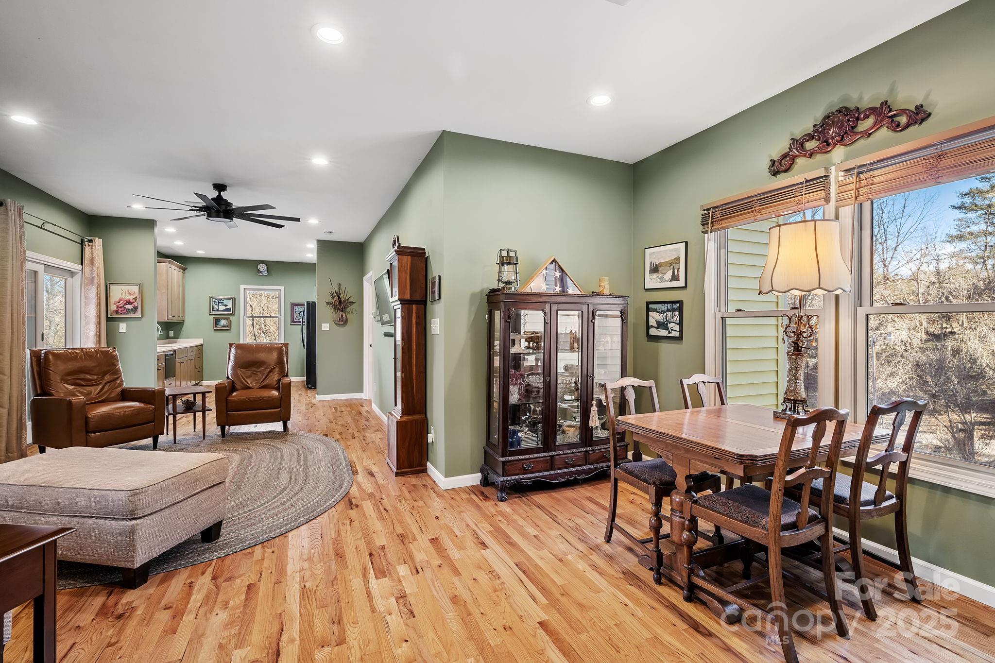 22 Sunset Lane Alexander, NC 28701 - Photo 21 of 48 a view of a dining room with furniture window and wooden floor
