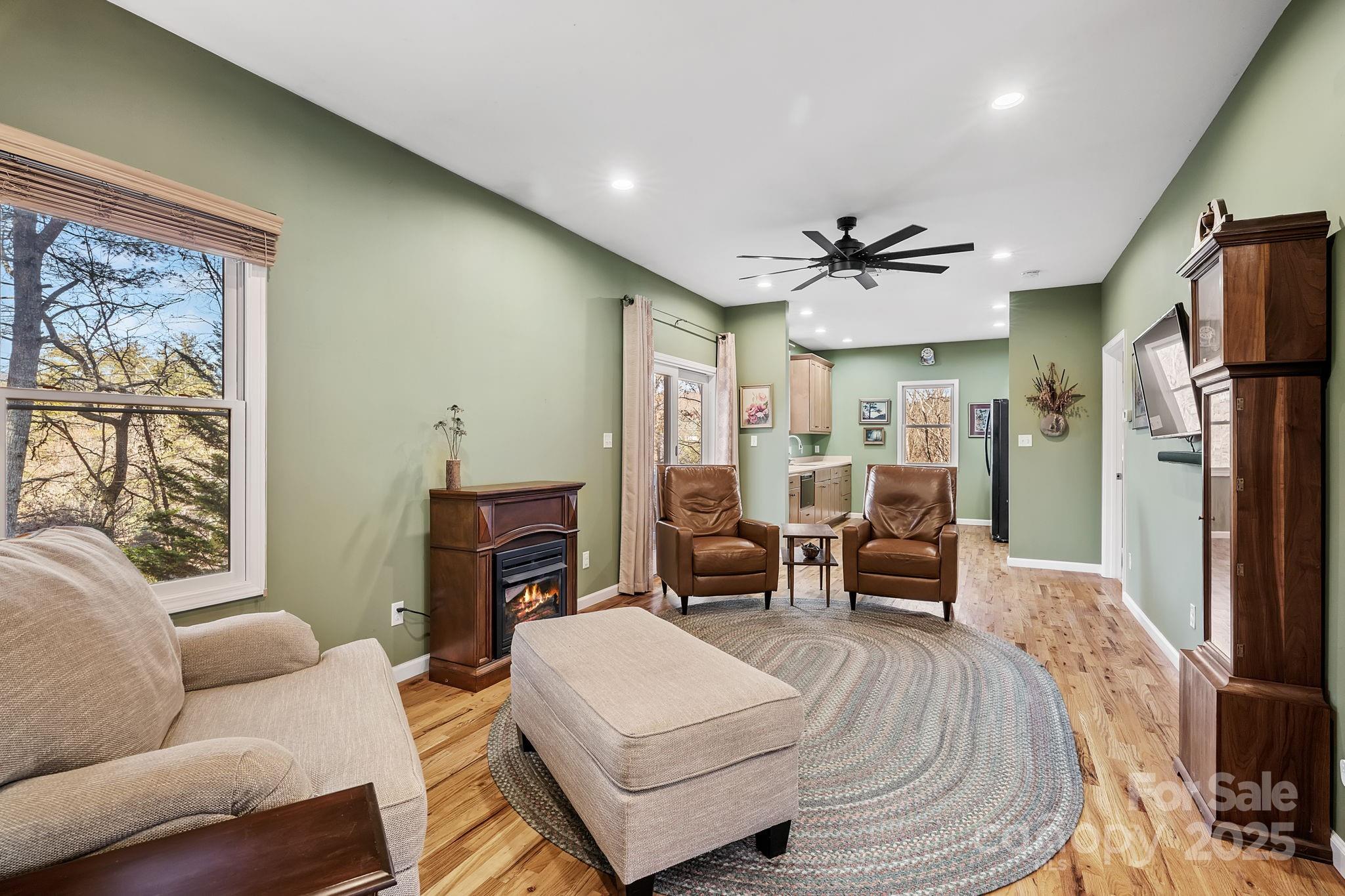 22 Sunset Lane Alexander, NC 28701 - Photo 22 of 48 a living room with furniture and a fireplace