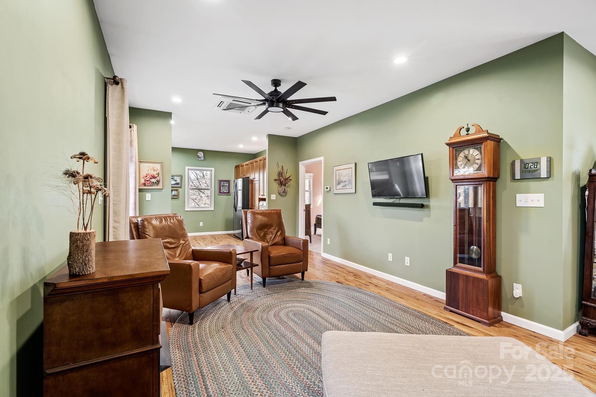22 Sunset Lane Alexander, NC 28701 - Photo 23 of 48 a living room with furniture and a flat screen tv