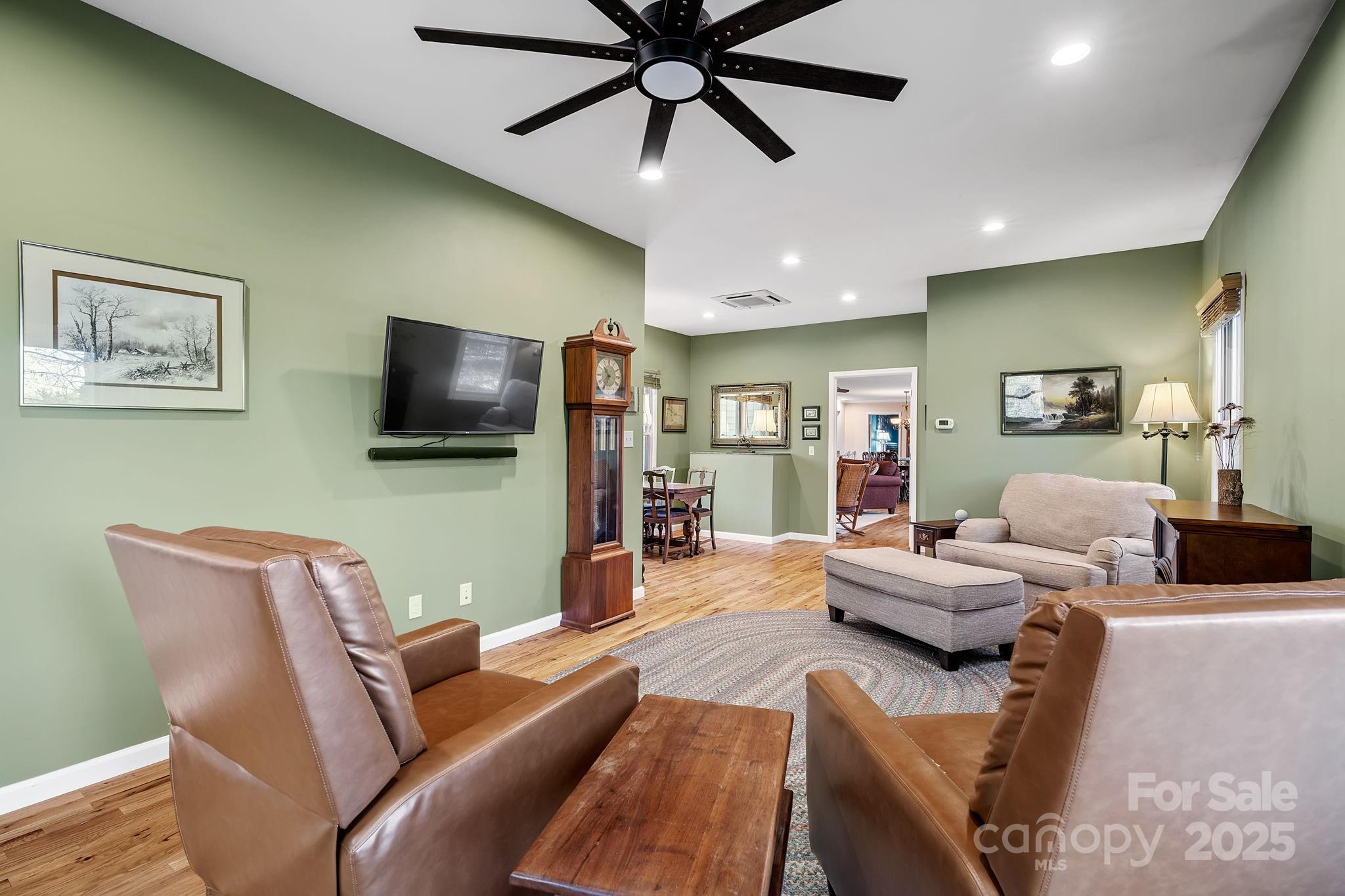 22 Sunset Lane Alexander, NC 28701 - Photo 24 of 48 a living room with furniture and a flat screen tv