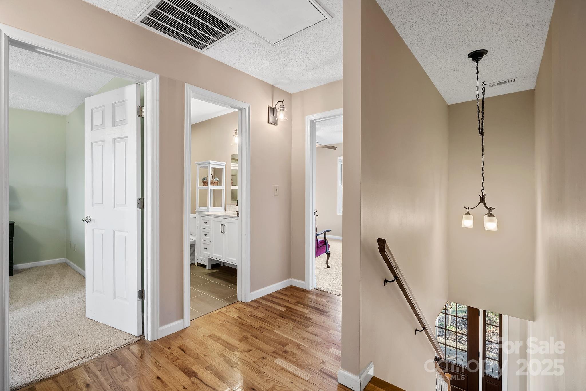 22 Sunset Lane Alexander, NC 28701 - Photo 31 of 48 a view of a bedroom with wooden floor and stairs