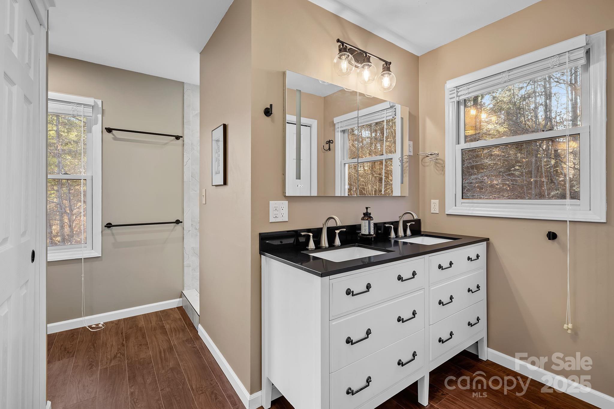 22 Sunset Lane Alexander, NC 28701 - Photo 33 of 48 a kitchen with granite countertop a sink and a refrigerator