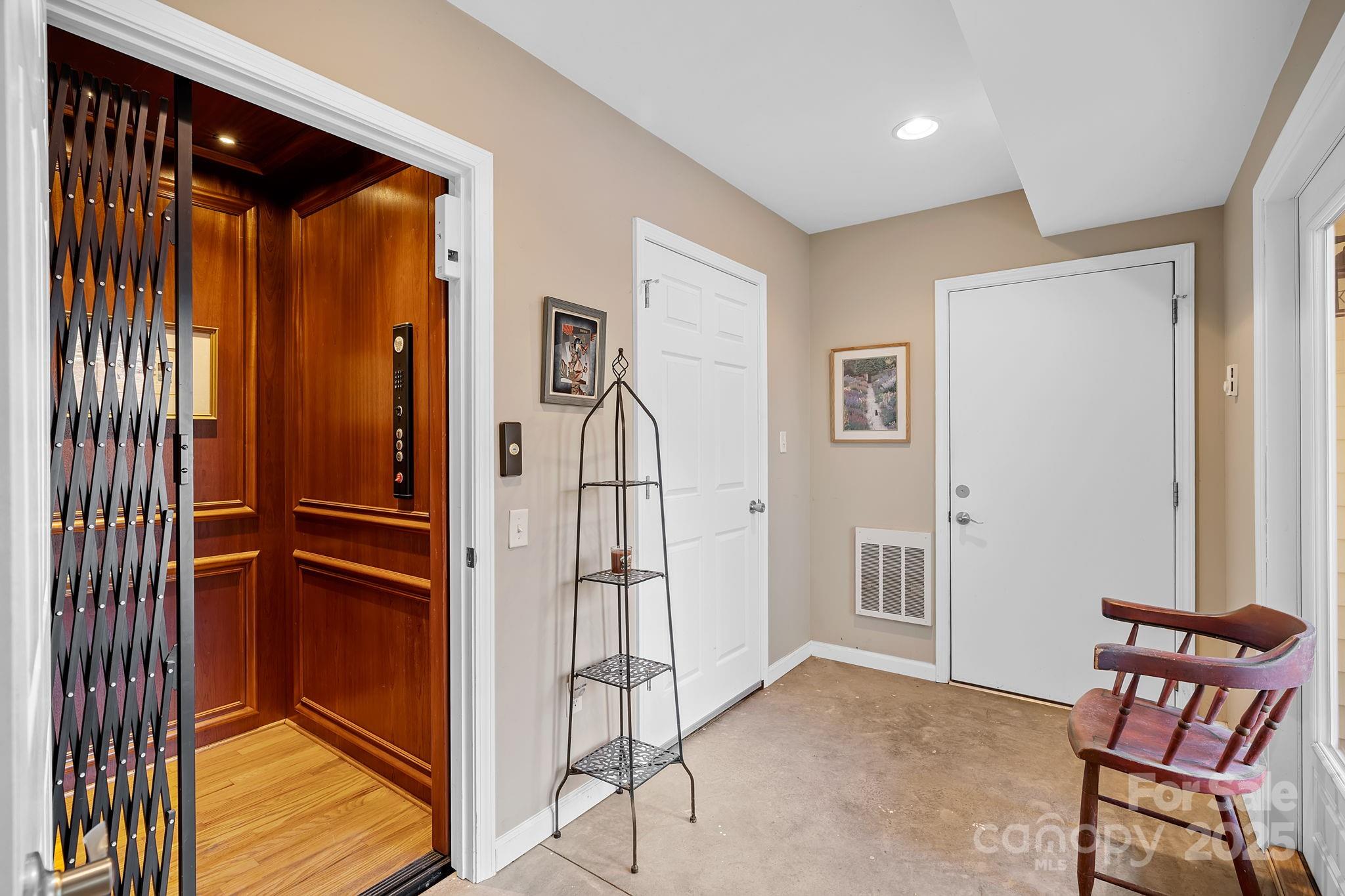 22 Sunset Lane Alexander, NC 28701 - Photo 41 of 48 a view of a hallway with windows and entryway