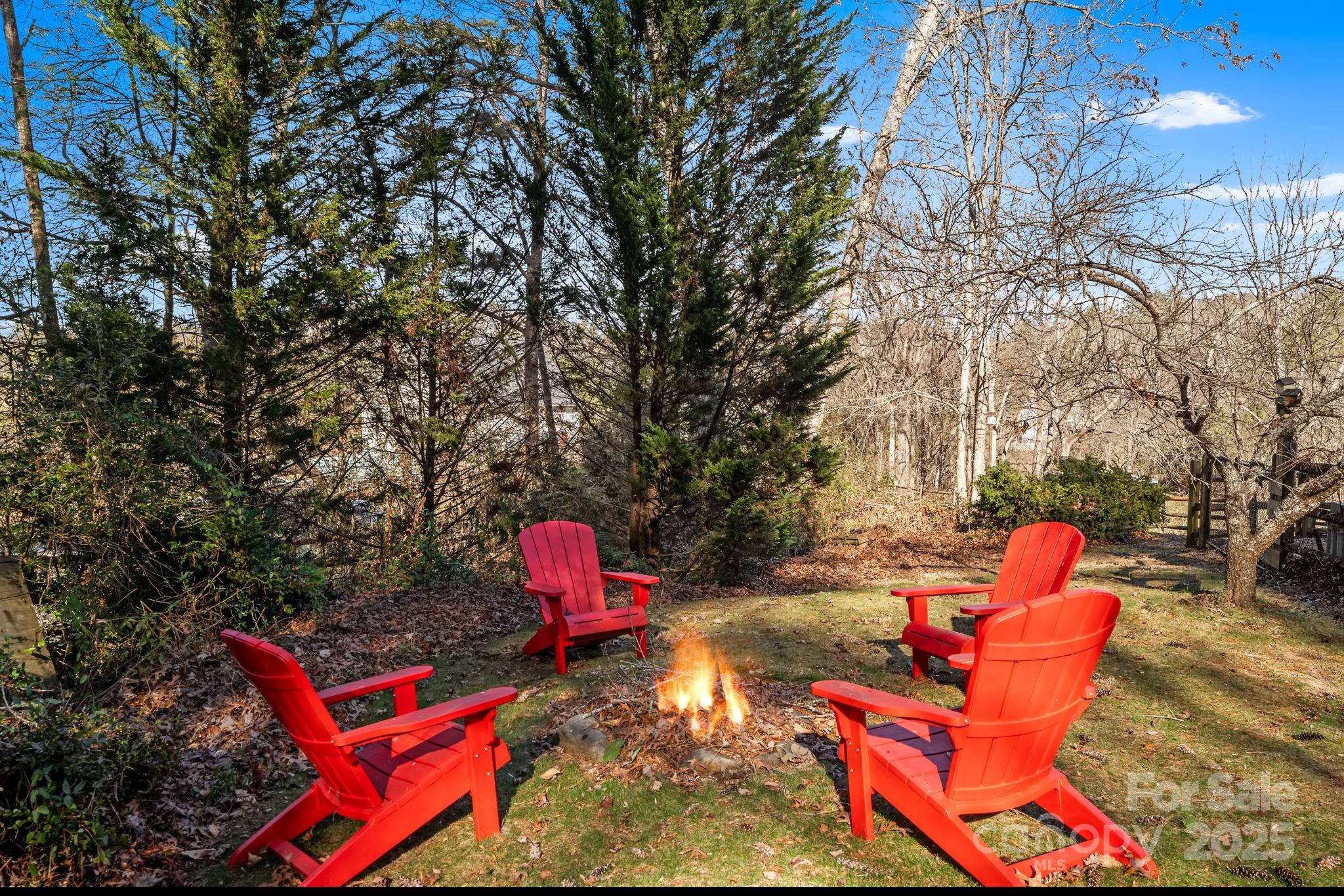 22 Sunset Lane Alexander, NC 28701 - Photo 44 of 48 an outdoor sitting area with red chairs