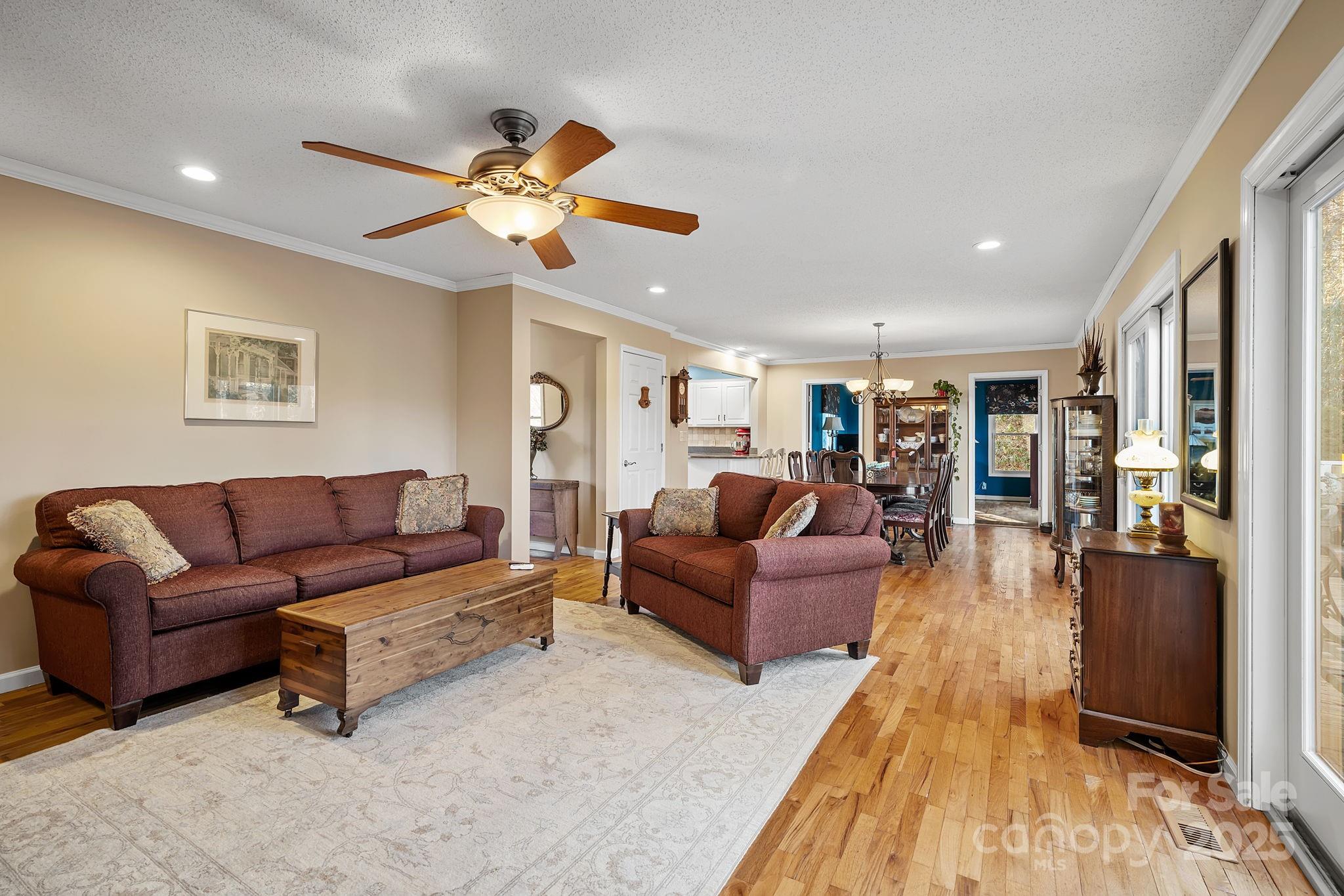 22 Sunset Lane Alexander, NC 28701 - Photo 7 of 48 a living room with furniture kitchen view and a wooden floor