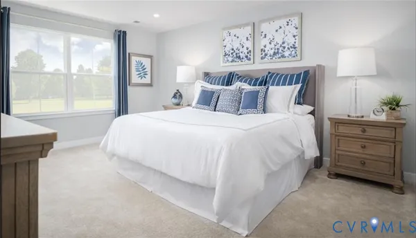 a bedroom with a bed and a lamp on table