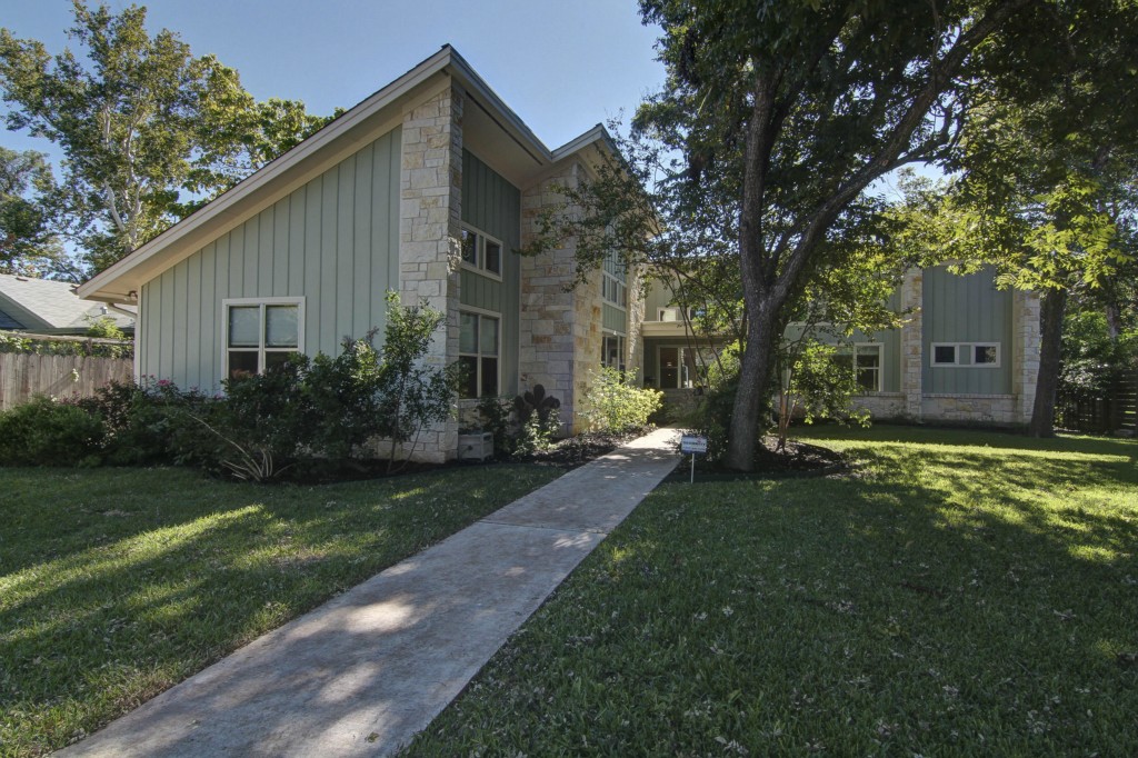 1203 Ruth Avenue Austin, TX 78757 - Photo 1 of 1 a backyard of a house with plants and large tree