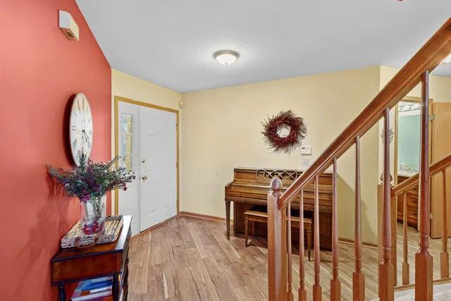 a view of staircase with wooden floor and a potted plant