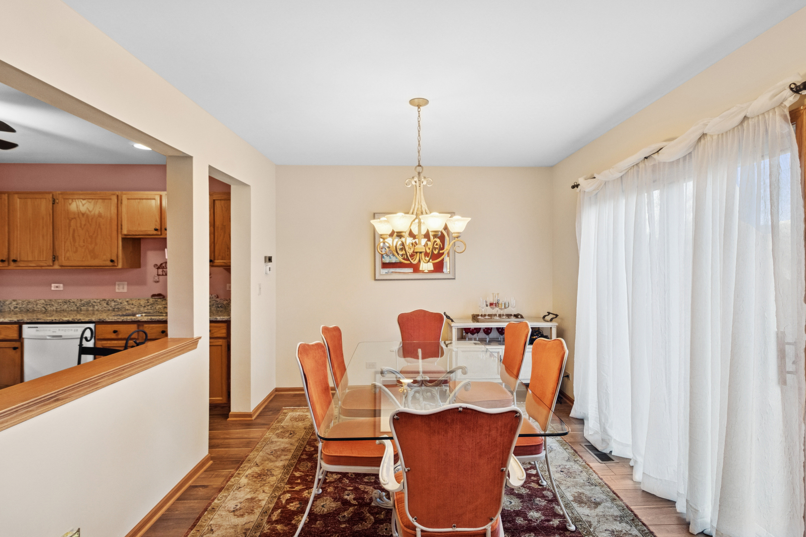 18 Peach Tree Court Algonquin, IL 60102 - Photo 7 of 23 a dining room with furniture a chandelier and wooden floor
