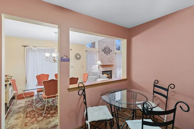 a dining room with furniture and wooden floor