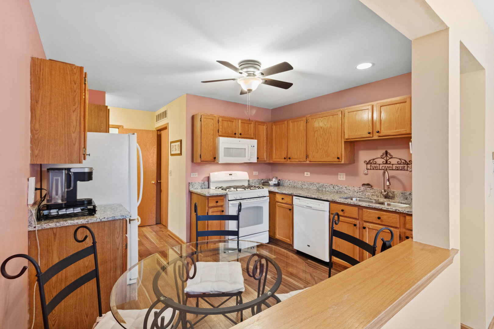 18 Peach Tree Court Algonquin, IL 60102 - Photo 9 of 23 a kitchen with stainless steel appliances granite countertop a stove a sink dishwasher and a refrigerator