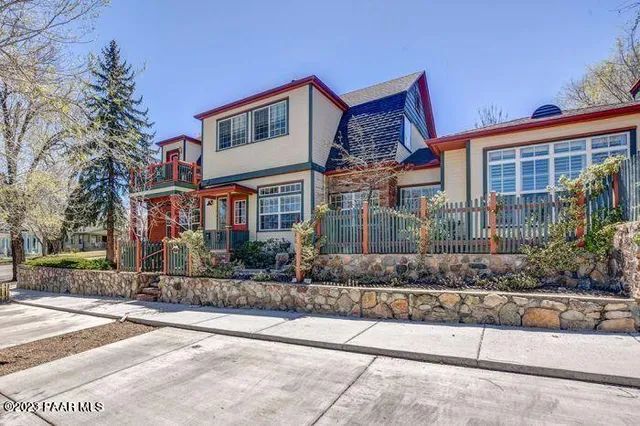 a front view of a house with a yard and a garage