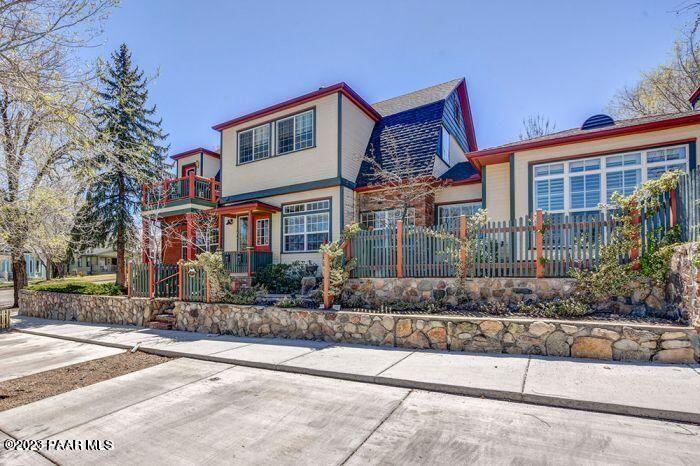 a front view of a house with a yard and a garage