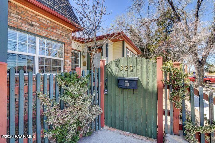 325 East E Union Prescott, AZ 86303 - Photo 2 of 11 a front view of a house with a garden