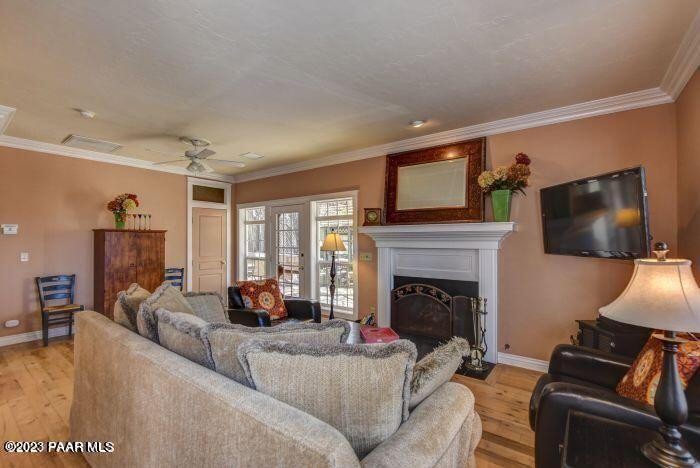 325 East E Union Prescott, AZ 86303 - Photo 3 of 11 a living room with furniture a flat screen tv and a fireplace