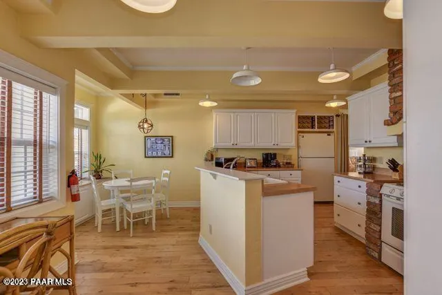 a kitchen with a sink a counter top space and appliances