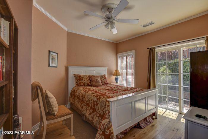 325 East E Union Prescott, AZ 86303 - Photo 7 of 11 a bedroom with a bed tv and a window