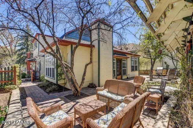 a view of backyard with patio