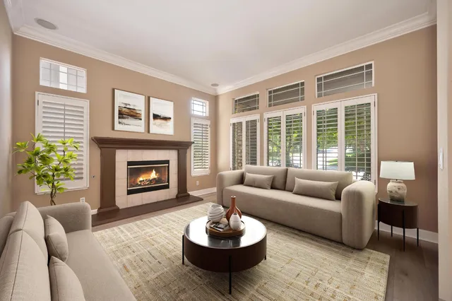 a living room with furniture a window and a fireplace