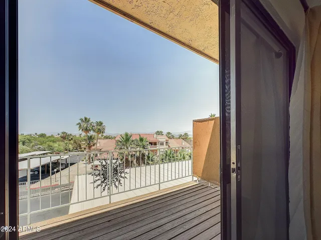 a view of balcony with furniture