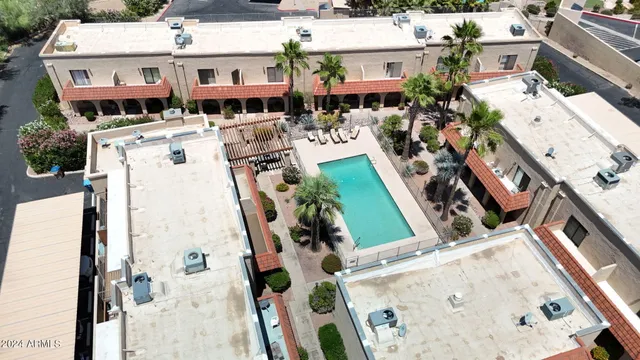an aerial view of a house with outdoor space