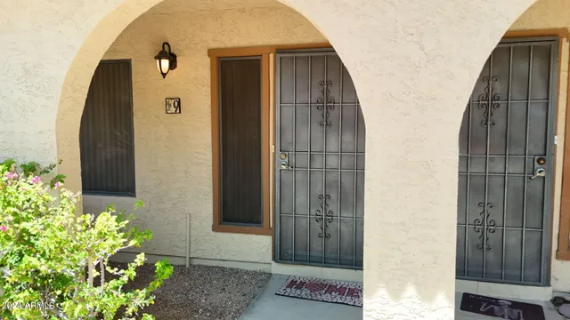 a room with a baby crib and a couch