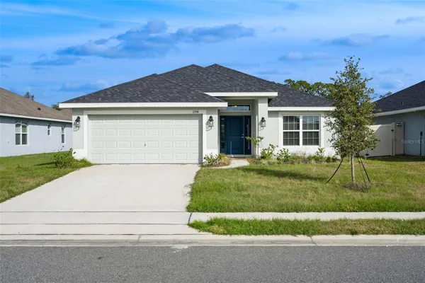 front view of a house with a yard
